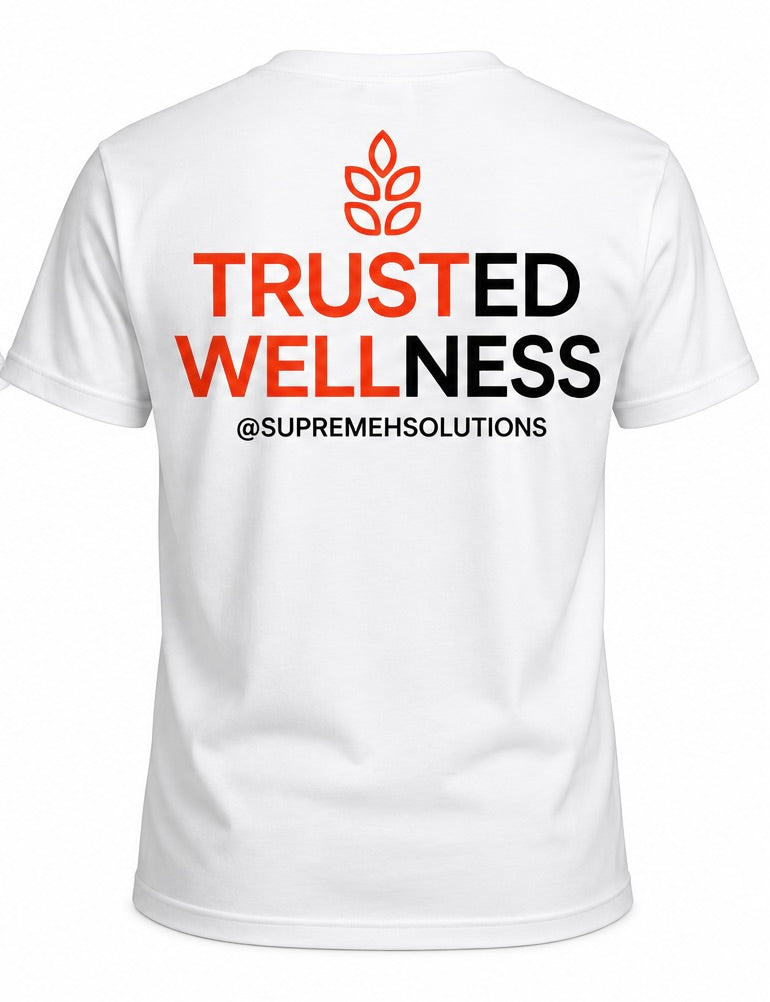White short-sleeve t-shirt shown from the back, featuring a graphic print with the words 'TRUSTED WELLNESS' in orange and black, a leaf icon above, and '@SUPREMEHSOLUTIONS' underneath.